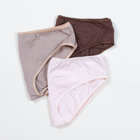 three underwear pieces on neutral background